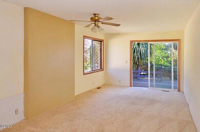 Living Room w/sliding door to front deck
