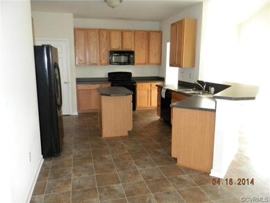 Kitchen-open to family room and sun room