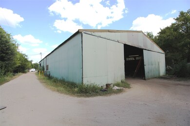 Sliding Bay Door in back of warehouse opens to 32'