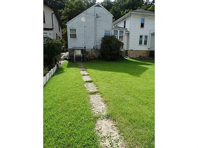 Exterior Back. Back yard view from the garage