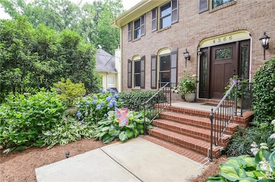 Property entrance featuring brick siding