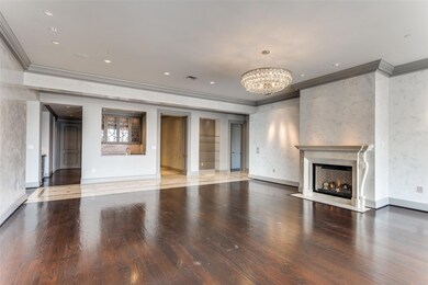 Unfurnished living room featuring crown molding, w