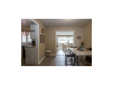 Dining Room opens to light-filled Family Room.
