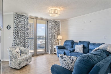 Living area with a wall of windows, crown molding,