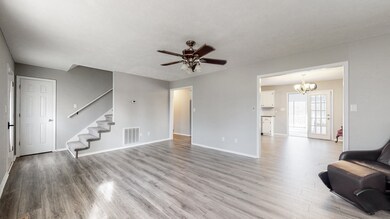 The stairs lead up to two additional large bedrooms for kids, guests, or an office.