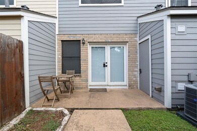 Doorway to property featuring brick siding and a 