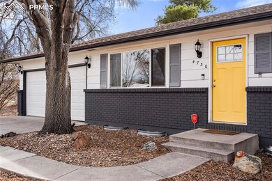 Doorway to property featuring driveway, an attache