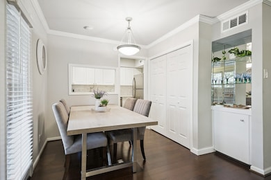 DINING AREA is perfect for entertaining as you flow seamlessly into the kitchen and living area (on the right).