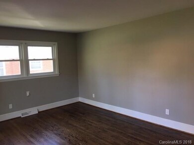 Large family room with beautiful hardwoods.