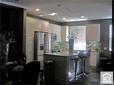 View of Kitchen coming up stairs from Downstairs L