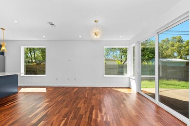 Unfurnished living room featuring wood finished f