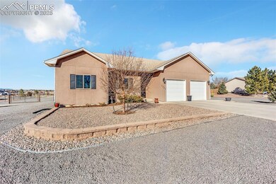 Ranch-style house with stucco siding, an attached 
