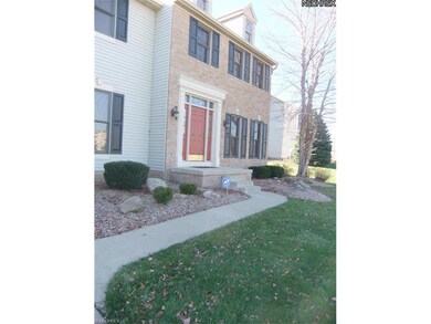 The landscaped front entrance leads you into...