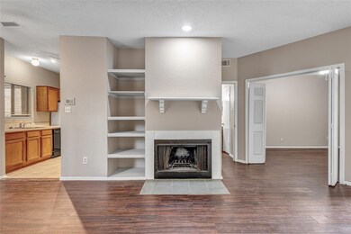 Unfurnished living room with hardwood / wood-style