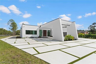 Rear view of house with a lawn