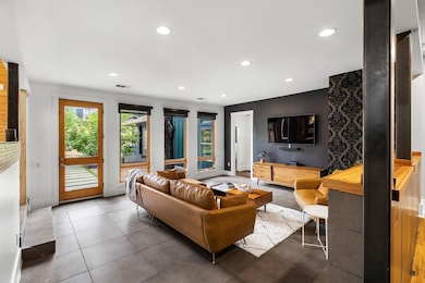 Living area featuring recessed lighting and tile 