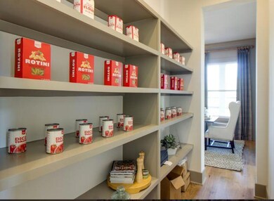 Walk thru pantry with wood shelving!  Great design and example of what pantry will look like!