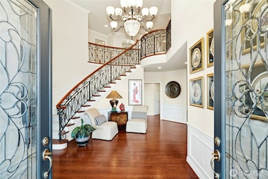 A grand entry welcomes you with timeless elegance, highlighted by custom-designed ironwork railing.