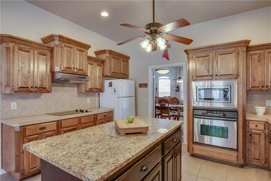 Kitchen with granite island. There is a lot of cou