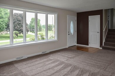 Spacious living room with a bay window.