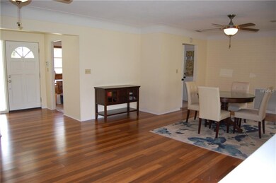 living room looking toward front door and dining r