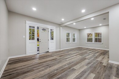 Foyer entrance featuring recessed lighting and light wood-style floors