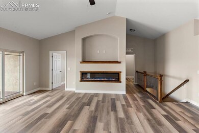 Unfurnished living room featuring lofted ceiling, 