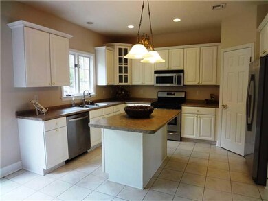 Kitchen. Ceramic tile flooring and stainless steel