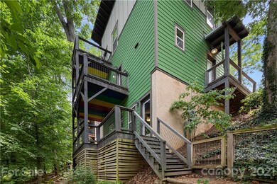 This is 26 Moore Avenue! 3 floors of sustainable Green Built living situated perfectly on a treehouse .15 acre lot within walking distance of Carrier Park in West Asheville. Totally!