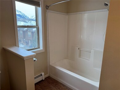 Bathroom featuring a mountain view, a baseboard he