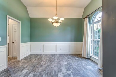 Celebrate Life in this dining room with wainscoting, large window for natural lighting, and just bring the guests!