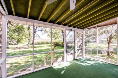 Sunroom / solarium with lofted ceiling