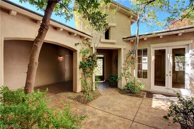 View to the custom wrought iron courtyard entrydoo