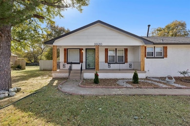 Bungalow with brick siding and a porch