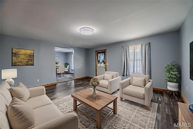 Living room with wood finished floors and baseboards virtual staging
