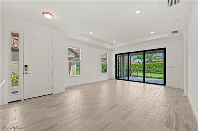 Entryway featuring baseboards, light wood-type flo