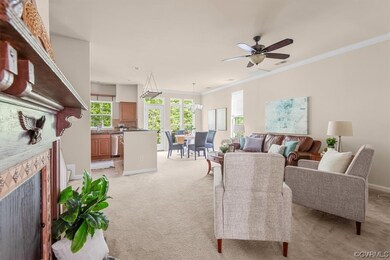 Living room with ceiling fan, ornamental molding,