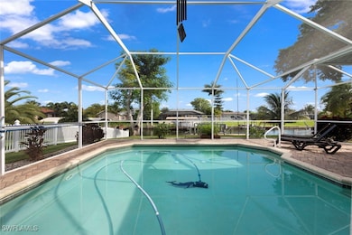 View of swimming pool featuring a patio area and a lanai