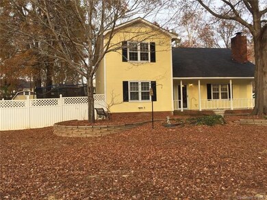 Vinyl fencing flanks both sides of this home