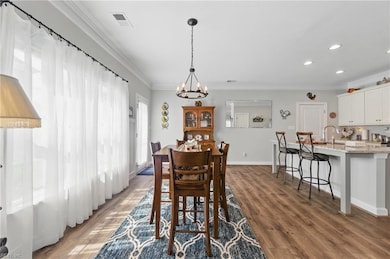 Step inside and to the left is the kitchen and din