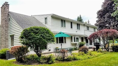 Back of house showing landscaping patio area.