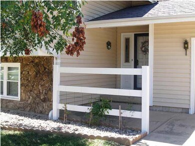 The front porch shelters guests.