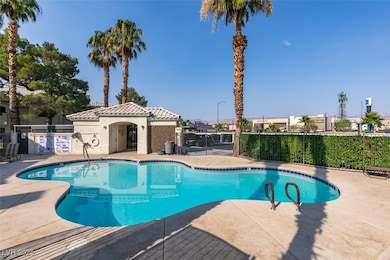 Community pool featuring a patio area