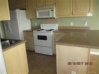 Lots of cabinets  and counter tops