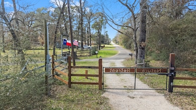 This photo shows a gated entrance to a property wi