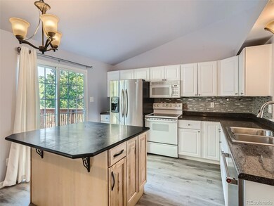 Updated kitchen with island with bar.