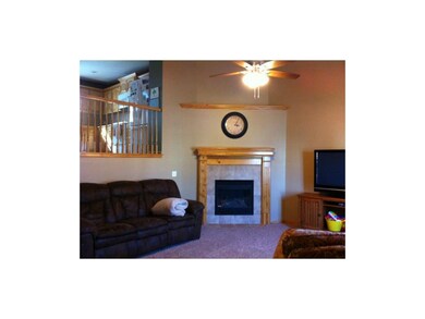 Kitchen overlooks gracious living room.