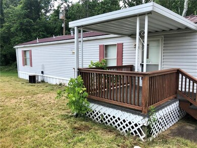 View of front of house with covered porch.