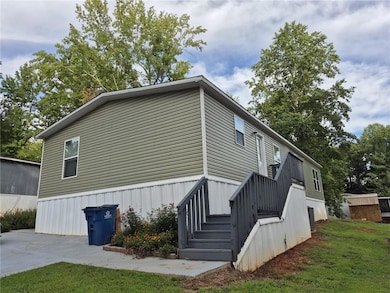 View of home's exterior with a yard