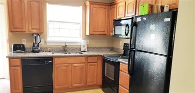 Kitchen has granite counter, matching appliances, 
